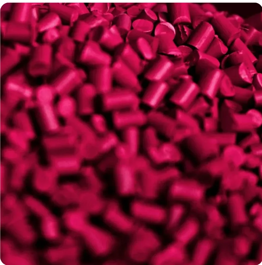 Close-up of magenta plastic resin pellets