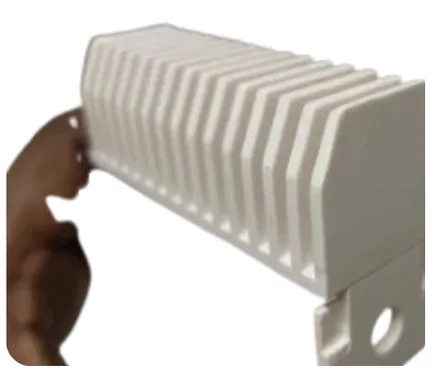 White molded plastic heat sink part