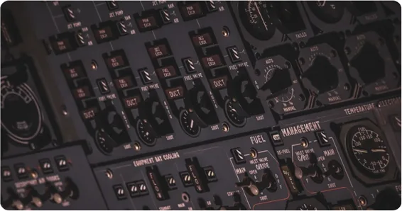 Close-up of an aircraft cockpit fuel management control panel