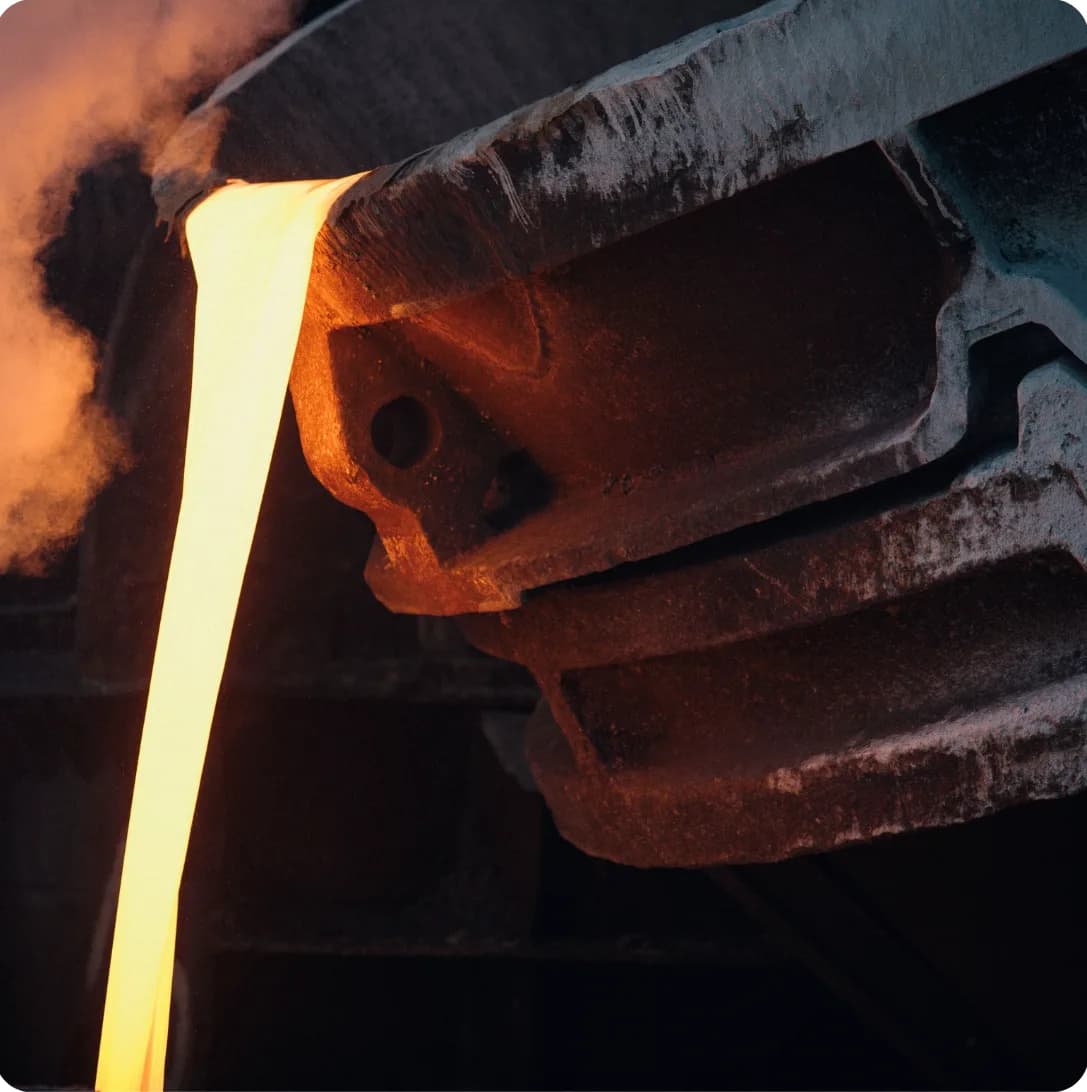 Molten metal pouring from a foundry ladle