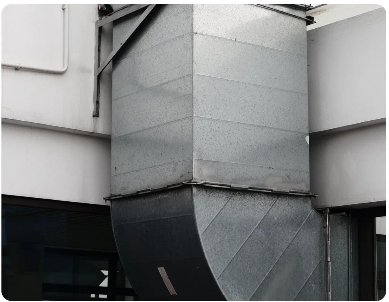 Galvanized sheet metal HVAC ductwork on a building exterior