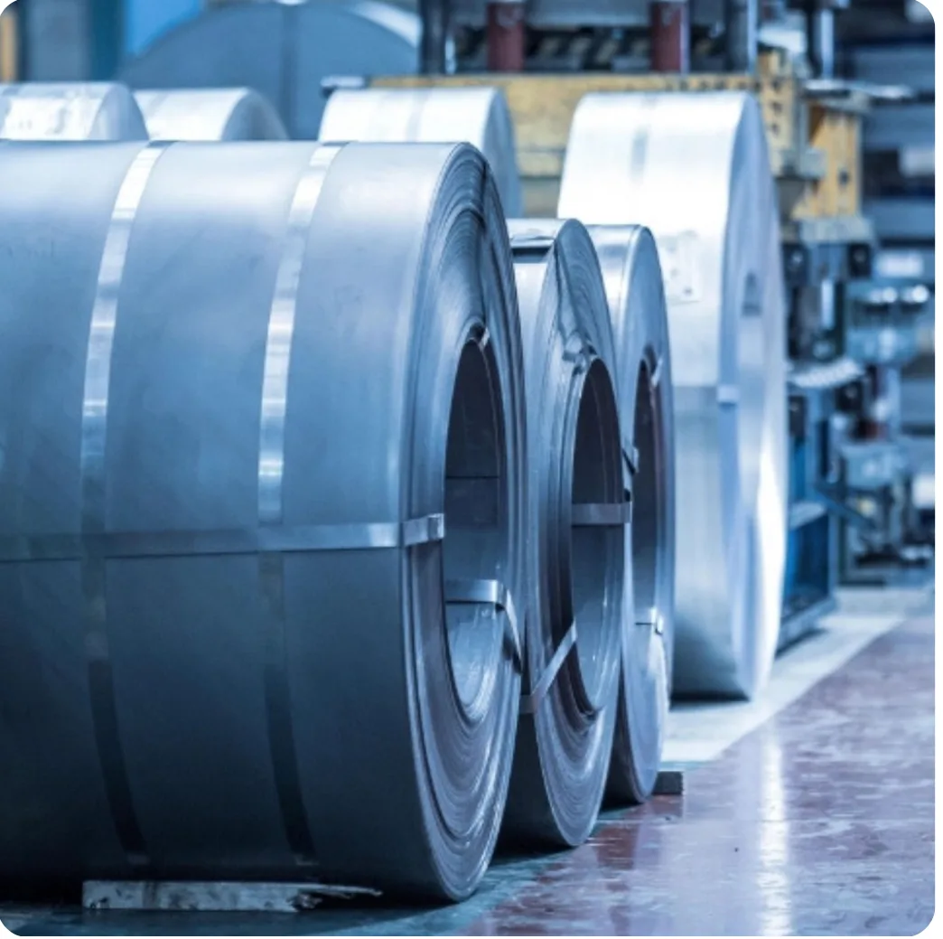 Rolled steel sheet coils on a factory floor